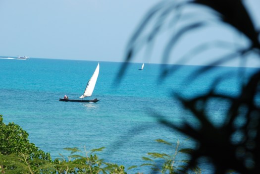 Traditional dhow fishing boat in the waters of Zanzibar.