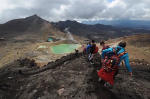 Hikers and the Emerald Lakes, Tongariro National Park, New Zealand.