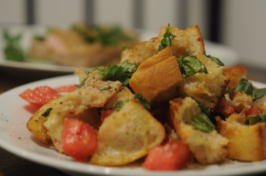Bread salad (panzanella), made with bread, tomatoes, shallots, basil, olive oil, and red wine vinegar.